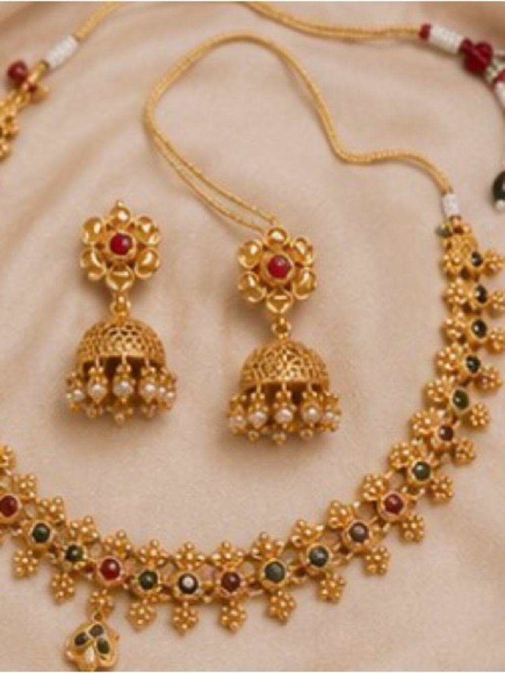 Gold-Colored Traditional Jhumka Necklace Set with Red & Green Stones